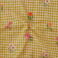 Malai Flowy Floral Yellow With Small Checks And Flower Motif Digital Print Fabric Malai Flowy Floral Yellow With Small Checks And Flower Motif Digital Print Fabric