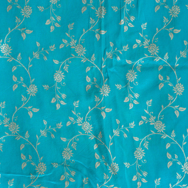 Dola Silk Brocade Blue With Golden Zari Flower Jaal Fabric