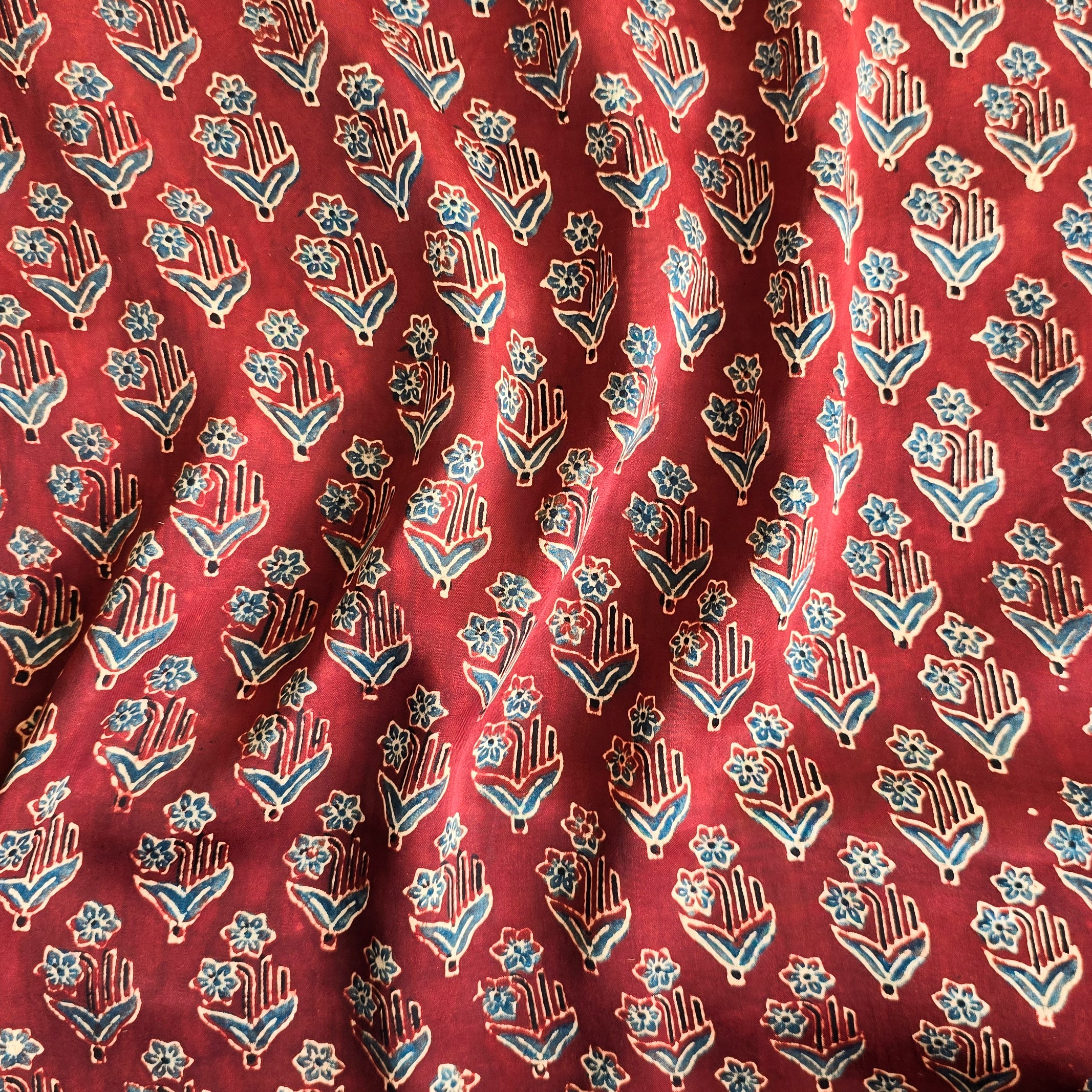 Modal Silk Rust Red With Blue Flower Plants Motif Fabric – Sanskruti